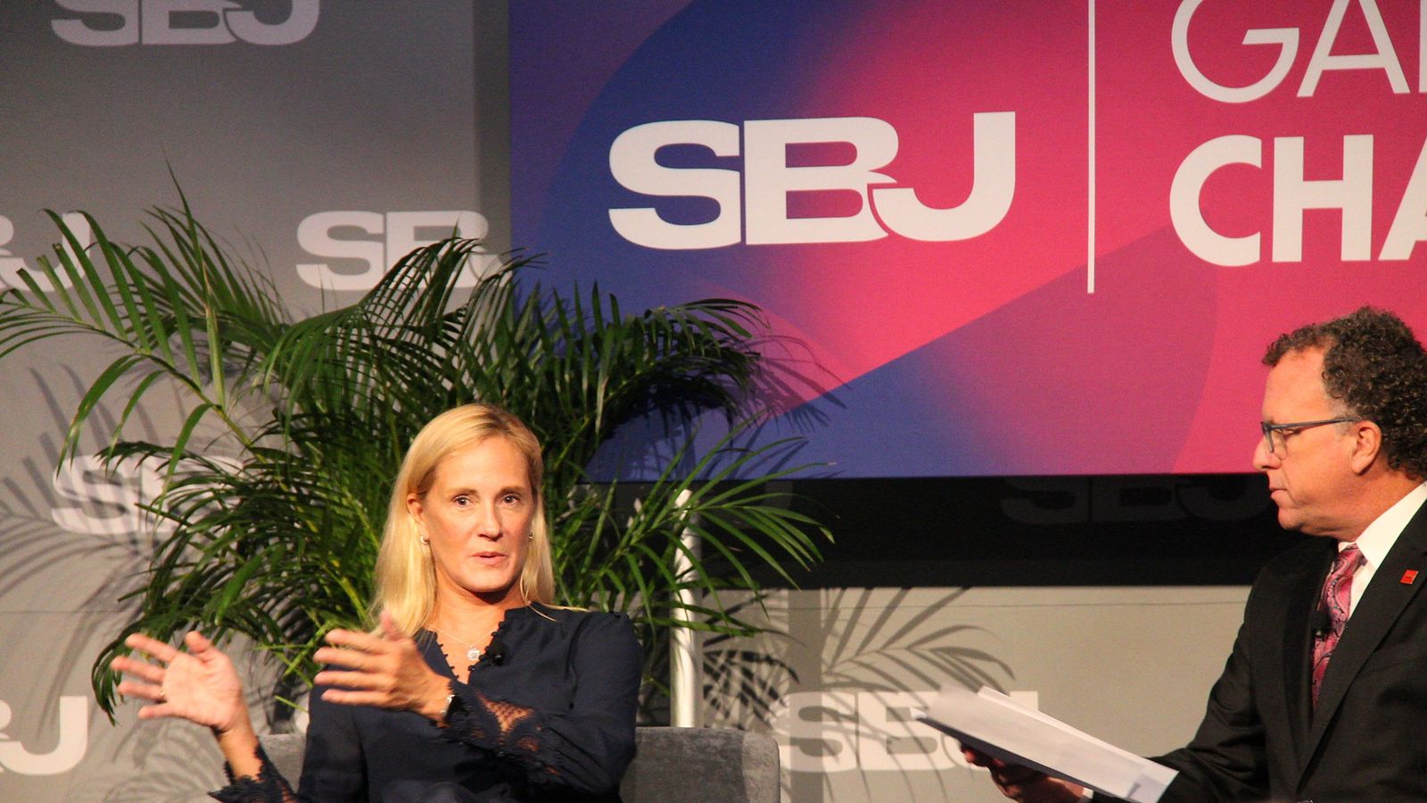 Kristin Lemkau gestures while answering a question from Abe Madkour