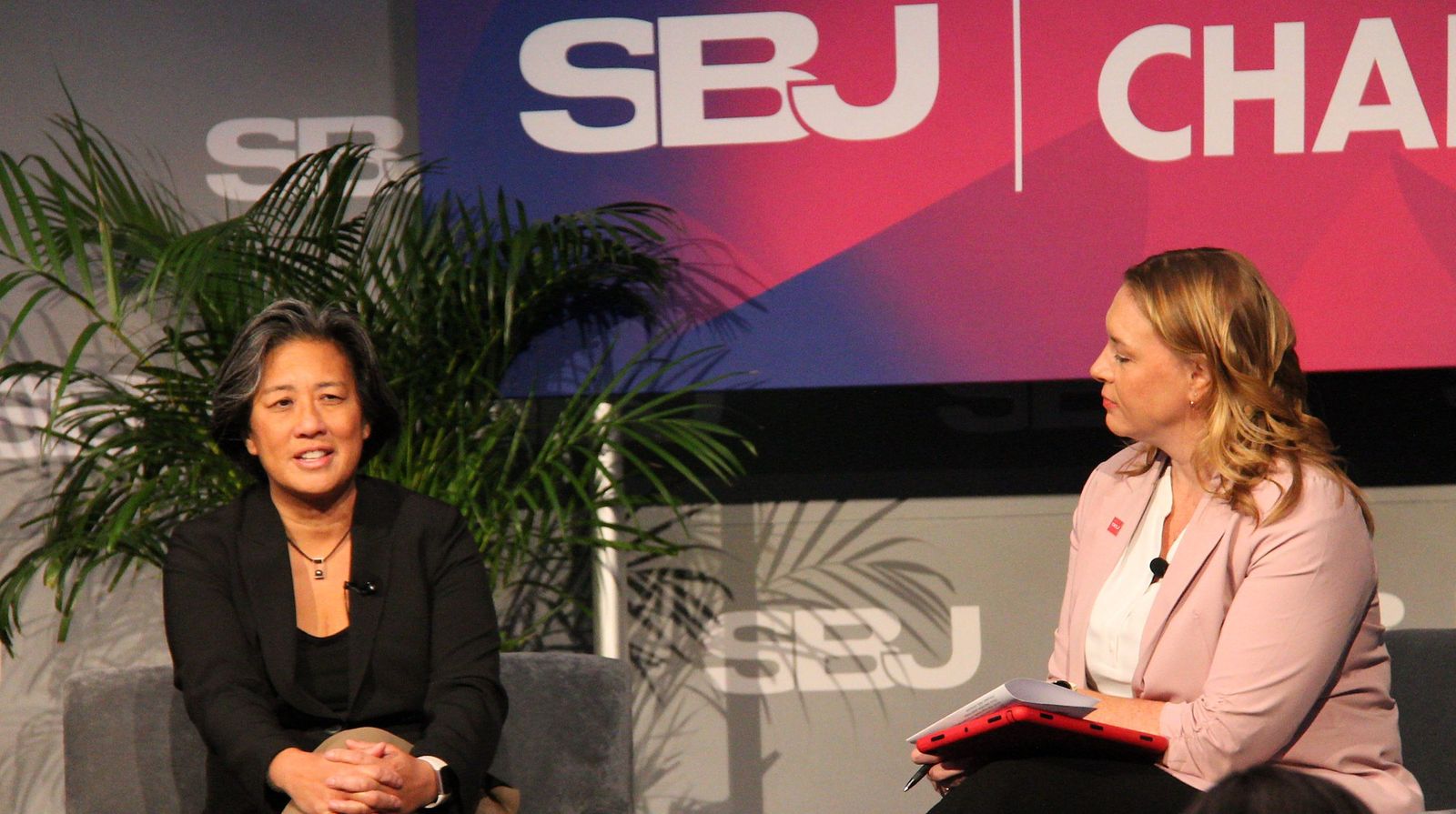 Kim Ng answers a question from Rachel Axon on stage