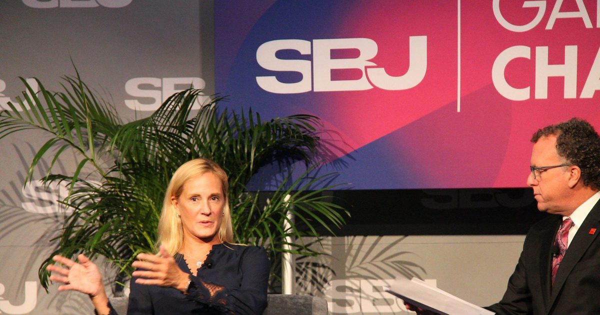 Kristin Lemkau gestures while answering a question from Abe Madkour