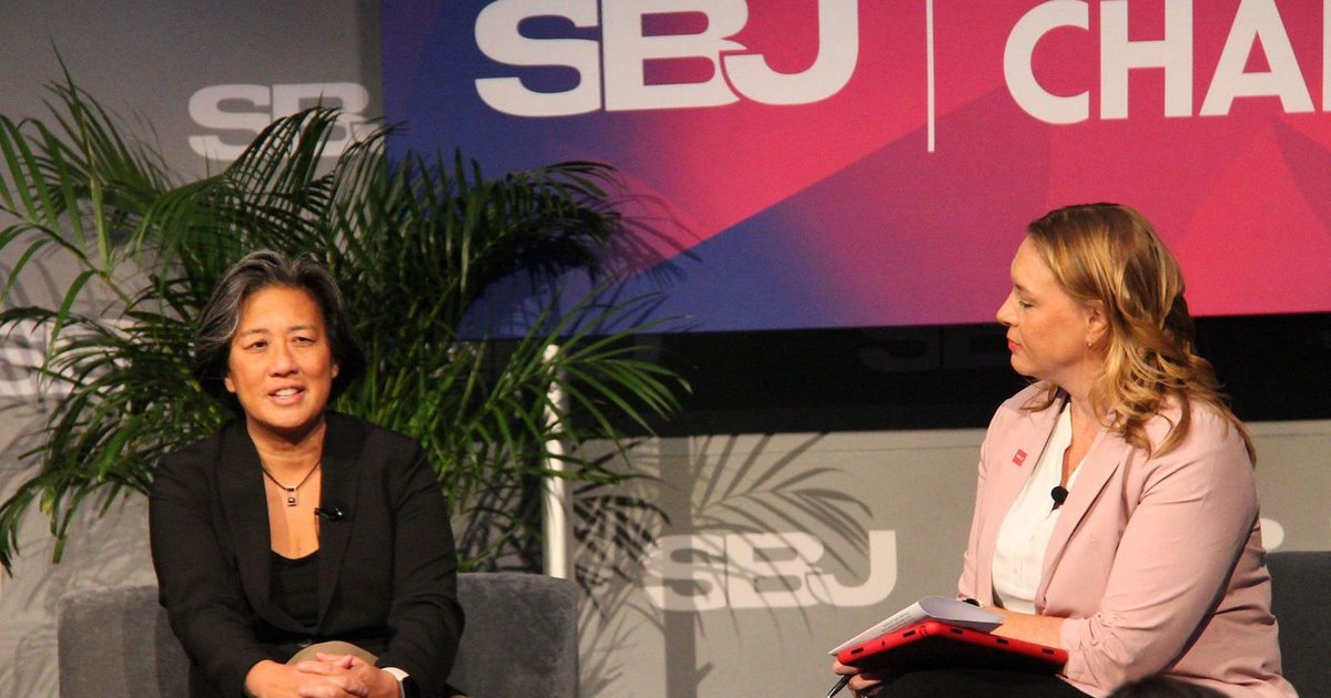 Kim Ng answers a question from Rachel Axon on stage