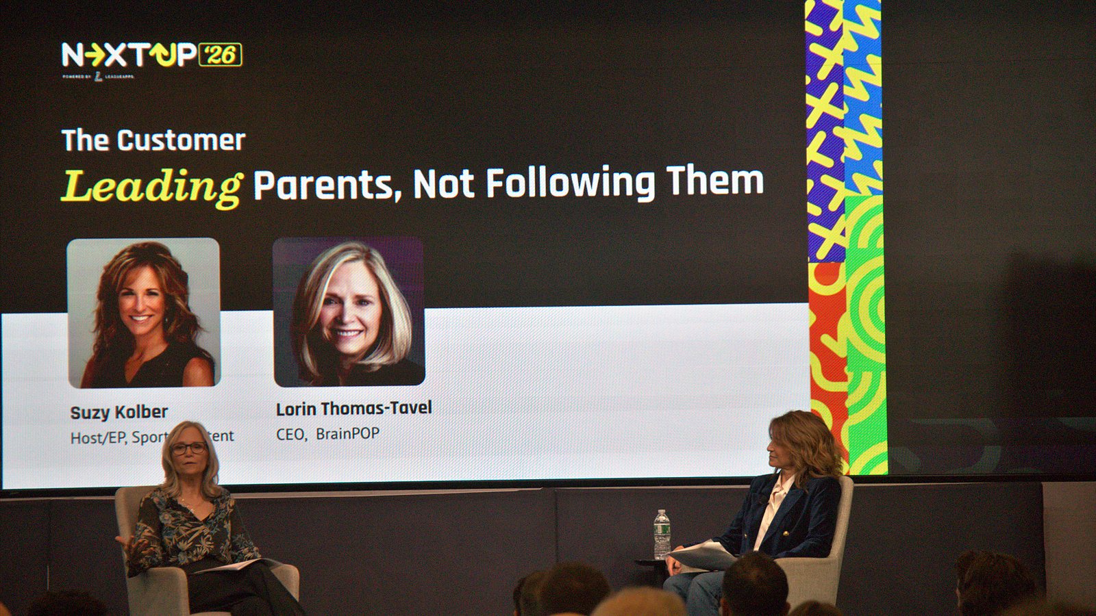 Lorin Thomas-Tavel and Suzy Kolber seated on stage beneath a slide titled Leading Parents, Not Following Them