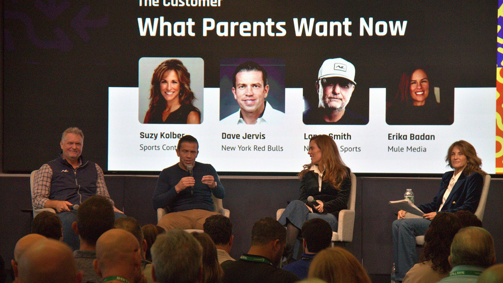 Four people seated on stage beneath a slide titled What Parents Want Now